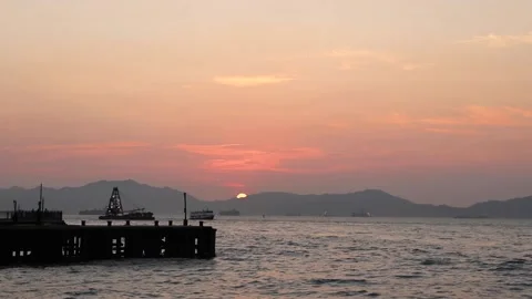Time lapse of sunset view, Victoria Harbour, Hong Kong. boats coming and goin Stock Footage 153085295