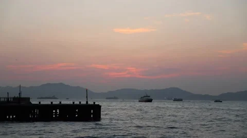 Time lapse of sunset view, Victoria Harbour, Hong Kong. boats coming and goin Stock Footage 153085299