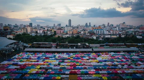 Time-Lapse with Sunsets and Clouds at Train Night Market Bangkok, Thailand Stock Footage 66366067