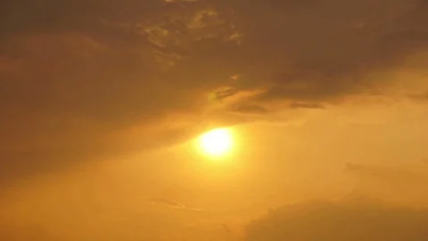Time lapse of sunsets and gold clouds Stock Footage 129286016