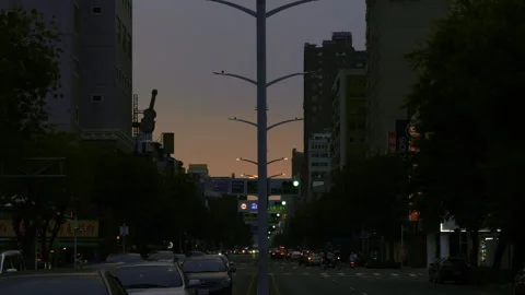 Time-lapse, sunsetting above busy street in Taiwan 8k HDR Stock Footage 257893623