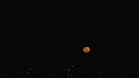 Time lapse of the Super full Moon rising during sunset Stock Footage 247184614
