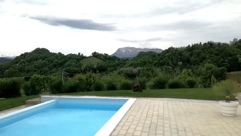 Time lapse with swimming pool, mountains and clouds Stock Footage 130231636