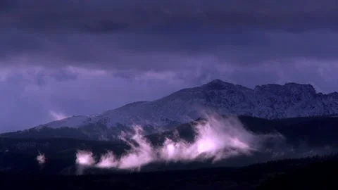 Time Lapse:  Swirling Mountain Clouds Lit By Sunrise Stock Footage 162829787
