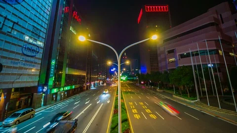 Time-lapse of Taipei 101 tower with traffic on road at night in Taipei, Taiwan  Stock Footage 124602744