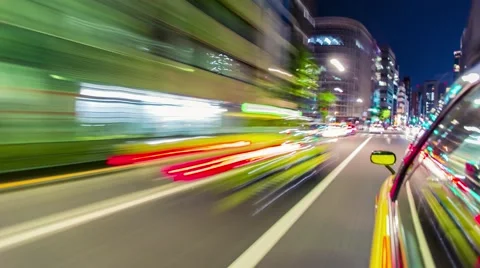 Time-lapse taxi ride through the Tokyo at night Stock Footage