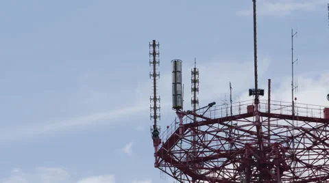 TIME-LAPSE: A telecommunication tower on a clouds background (close up) Stock Footage 64841757