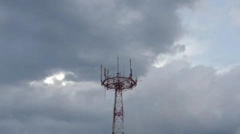 TIME-LAPSE: A telecommunication tower in a cloudy day Видео 64841030