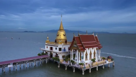 Time lapse of temple located on the sea at sunset timing during Buddhist day Stock Footage 133081394