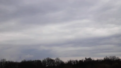 Time lapse: tense clouds flying in the sky blown by light wind Stock Footage 129270597