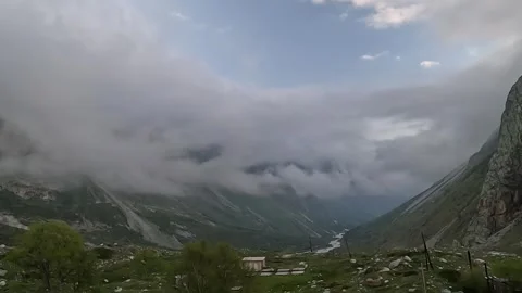 Time-lapse of thick clouds descending over mountain slopes Stock Footage 337302304