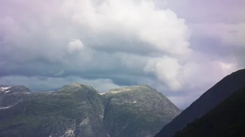 Time lapse of thunderclouds forming over big mountains in Norway. Stock Footage 245489667