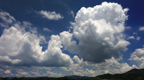 Time-lapse of thunderhead clouds in hot, summer day.  Stock Footage 65786736