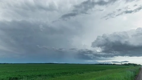 Time lapse of a thunderstorm clouds with a small lightning strike. Stock Footage 132807981