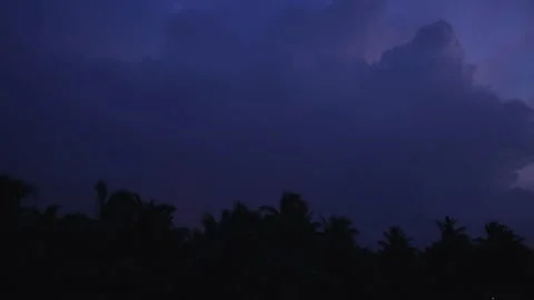 Time lapse of a thunderstrom with clouds moving and trees in the foreground.   스톡 동영상 148406023