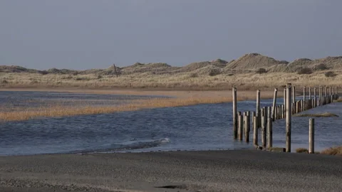 Time lapse of tide coming in over the causway in Northumberland UK 4K Video stock 206223517