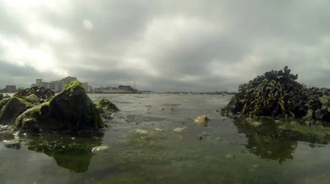 Time lapse tide coming in rocks in foreground 01 Stock Footage 33898907