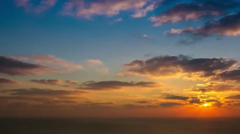 Time lapse timelapse of clouds crossing the sky at sunset Stock Footage 65174996