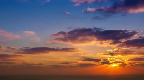 Time lapse timelapse of clouds crossing the sky at sunset Stock Footage 65175025