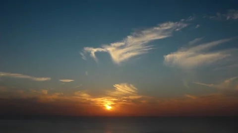 Time lapse timelapse of clouds crossing the sky at sunset Stock Footage