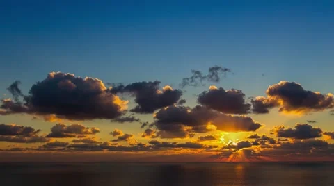 Time lapse timelapse of clouds crossing the sky at sunset Stock Footage 65175191