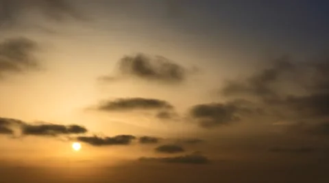 Time lapse timelapse of clouds crossing the sky at sunset Stock Footage 65175919