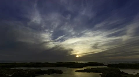 Time lapse timelapse of clouds crossing the sky at sunset Stock Footage 65176230