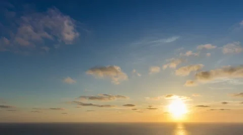 Time lapse timelapse of clouds crossing the sky at sunset Stock Footage 65176313