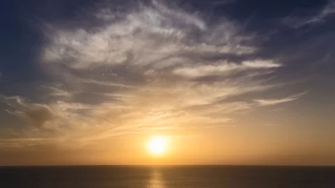 Time lapse timelapse of clouds crossing the sky at sunset Stock Footage 69910817