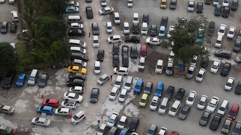 Time lapse top view (birds eye) of cars leaving car park after work Stock Footage 124882023