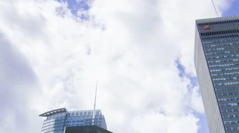 TIme Lapse tops of two buildings pan clouds MS Stock Footage 50827671