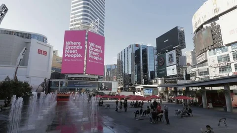 Time lapse of Toronto landmark Yonge-Dundas Square during the day Stock Footage 73580721