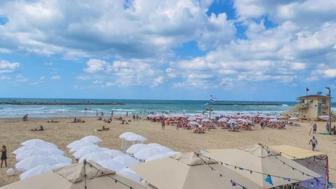 Time lapse of the tourist on the beach Stock Footage 85960655