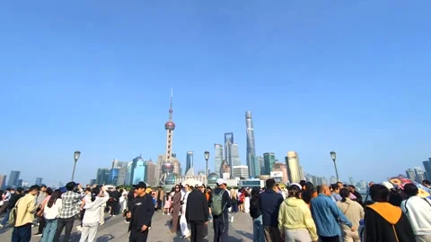 Time-lapse of Tourists Crowd on Shanghai Bund with Pudong Skyline Stock Footage 333939861
