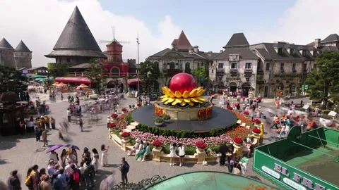 Time lapse of tourists at crowded Ba Na Hills square and moving clouds Stock Footage 345645505