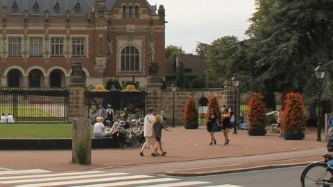 Time lapse of tourists in front of Peace Palace, The Hague - wide - zoom Stock Footage 113570668