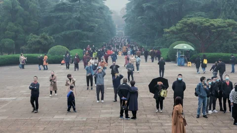 Time lapse of tourists marching along the path to Dr. Sun Yat-Sen Mausoleum Stock Footage 143755334