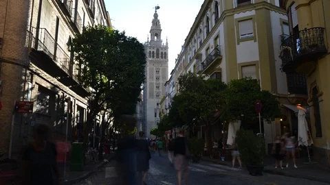 Time lapse of tourists strolling on cobblestone street, Seville, Spain Stock Footage 92296633