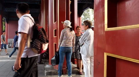 Time Lapse: Tourists walk through a red gate of the Forbidden City Stock Footage 41302046