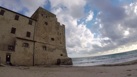 Time lapse of a tower of a coastal fortification on the empty beach Stock-Footage 83321423