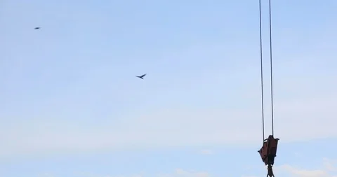 Time lapse of the tower crane at the construction site against the blue sky Stock Footage 103337985
