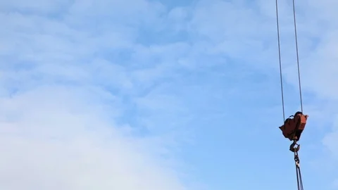 Time lapse of the tower crane at the construction site against the blue sky Stock Footage 103338651