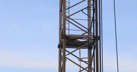 Time lapse of the tower crane at the construction site against the blue sky Stock-Footage 103339791
