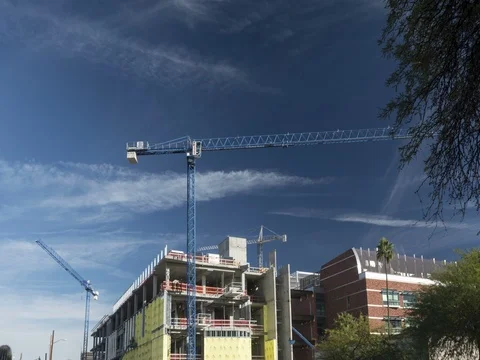 Time lapse of tower cranes in operation at a construction site Stock Footage 71308641