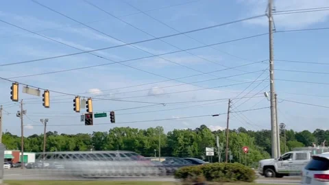 Time-lapse traffic at a 4 way intersection on a busy highway Stock Footage 153612256