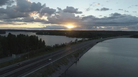 Time lapse of traffic across strait on a lake Stock Footage 86490832