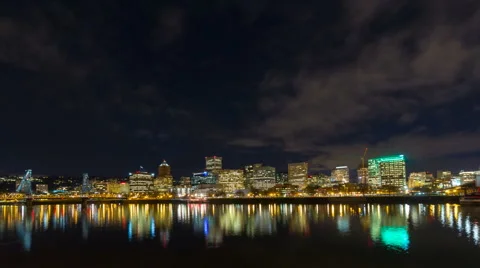Time Lapse of Traffic and Clouds Over Portland OR with Water Reflection at Night Stock Footage 46702426