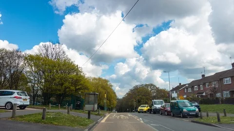Time lapse of traffic and clouds on Dee Road in Reading, UK Stock Footage 105740018