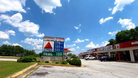 Time-lapse of traffic and the current gas price Stock Footage 141891710