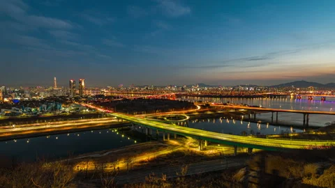 Time lapse  traffic on  bridge crossing river han Stock Footage 147355676
